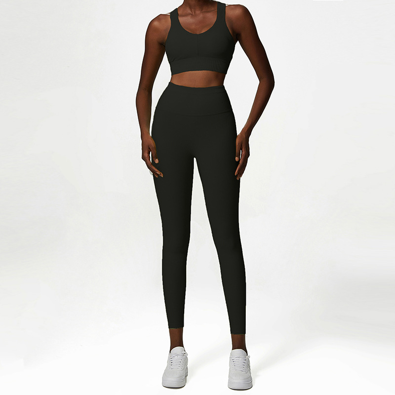Ensembles de yoga pour femmes 2 pièces dos croisés hauts d'entraînement personnalisé sans couture taille haute surdimensionné logo côtelé impression gym personnalisé de haute qualité en gros leggings